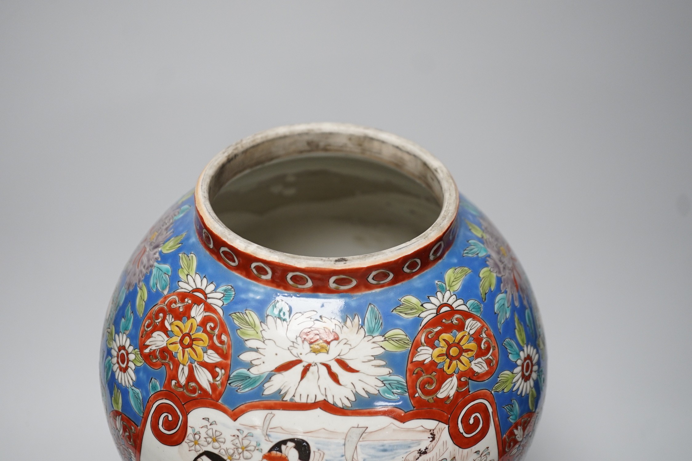 A large Japanese vase with carved wooden cover and base, 38cms high